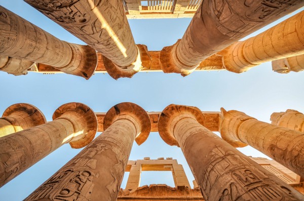 Columns and blue sky in the great hypostyle hall at the temple of Amon-Re in Karnak, Egypt